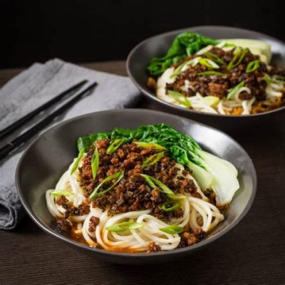  Dan Dan Mian:   noodles bathed in a fiery sauce with an addictive sesame punch? 